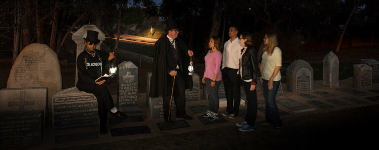 San Diego ghost tour hosts and guests at cemetery