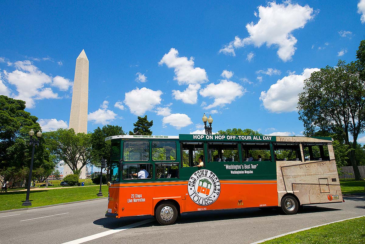 trolley driving by Washington Monument