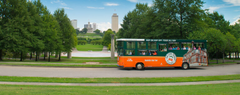 Old town trolley with nashvillle landscape behind