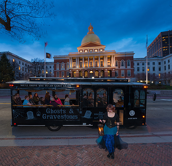 Boston Ghosts & Gravestones trolley and host in front of State House