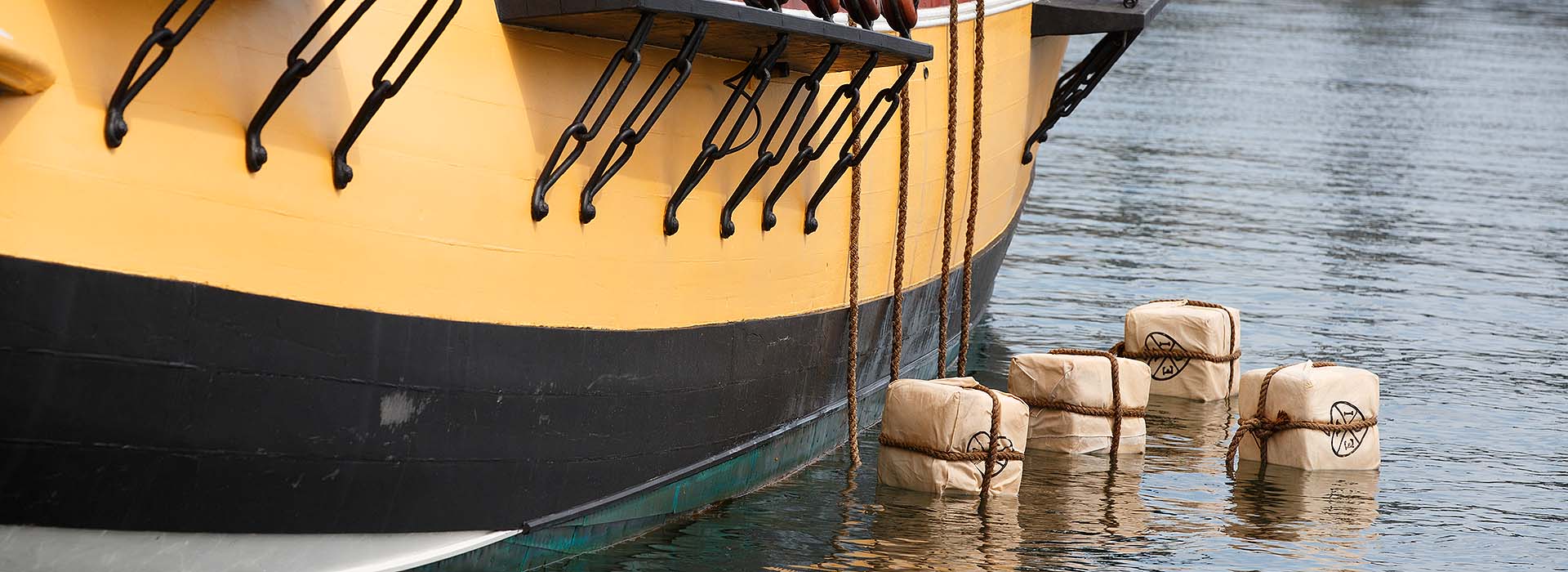 tea chests floating on water at the Boston Tea Party Ships