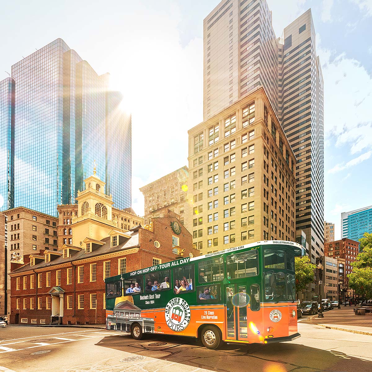 Boston trolley driving past Old State House