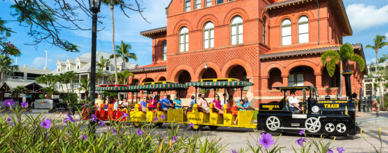 the conch tour train infront of the custom house in key west