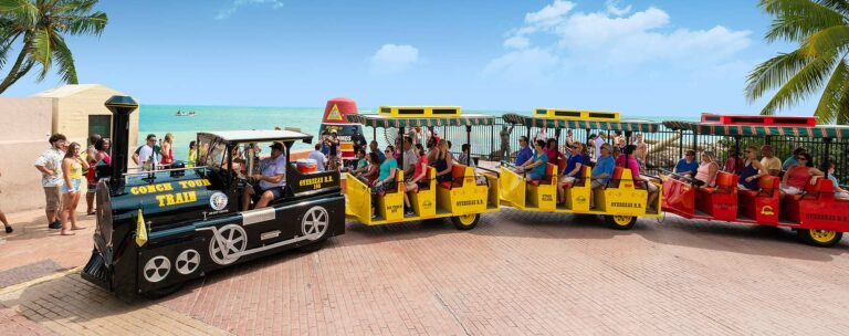 Conch Tour Train driving by Southernmost Point