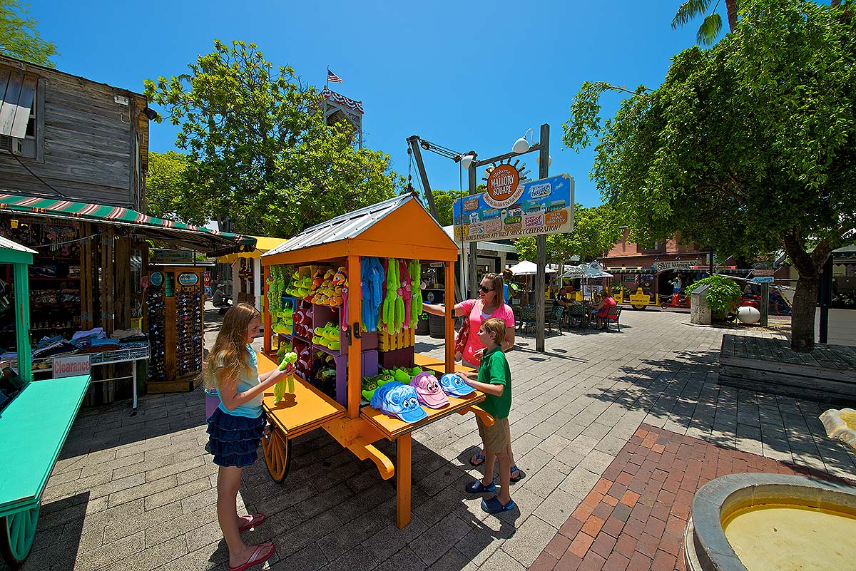 family shopping at Mallory Square carts