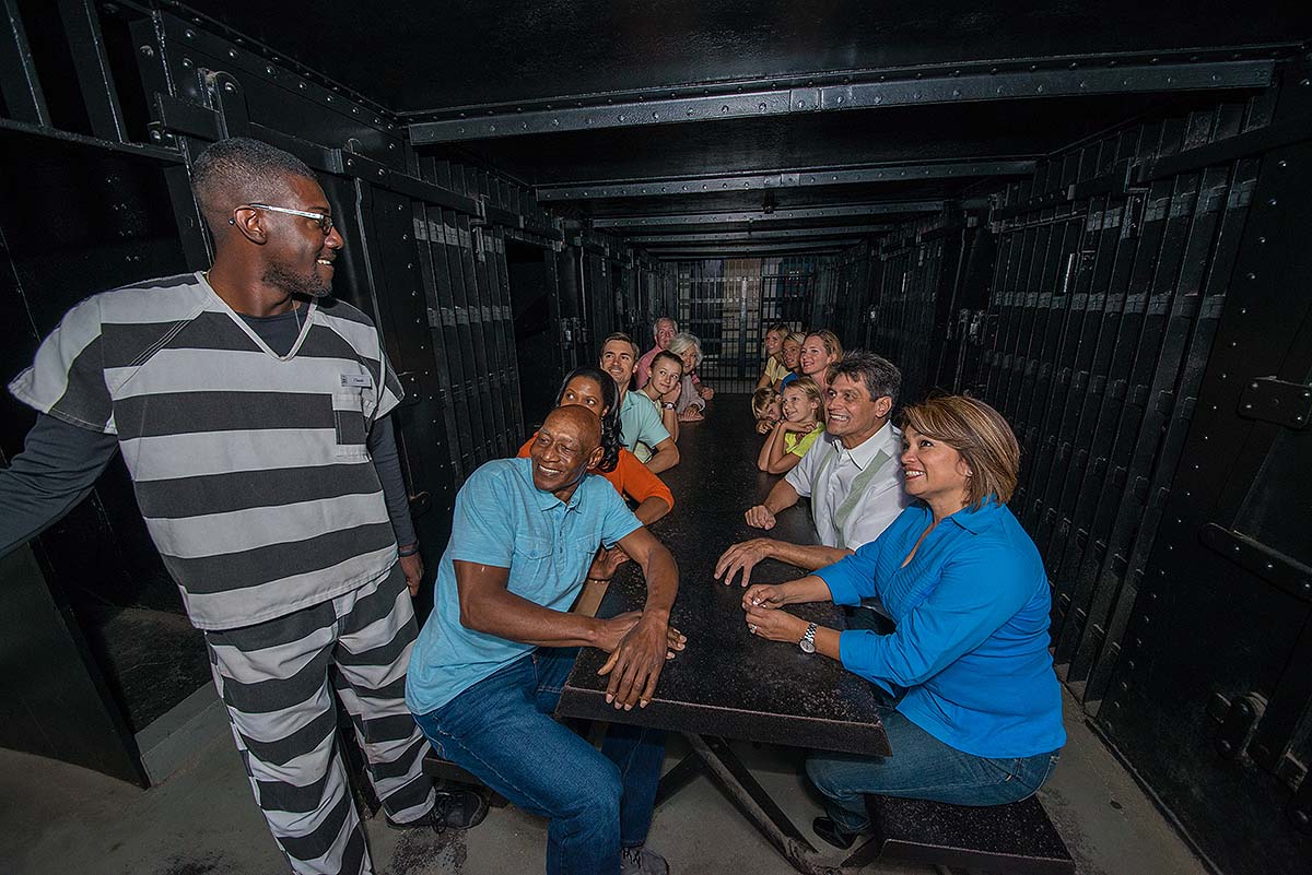 tour guide and guest inside Old jail cell