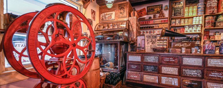 Oldest Store Museum exhibit featuring a wheel and a counter