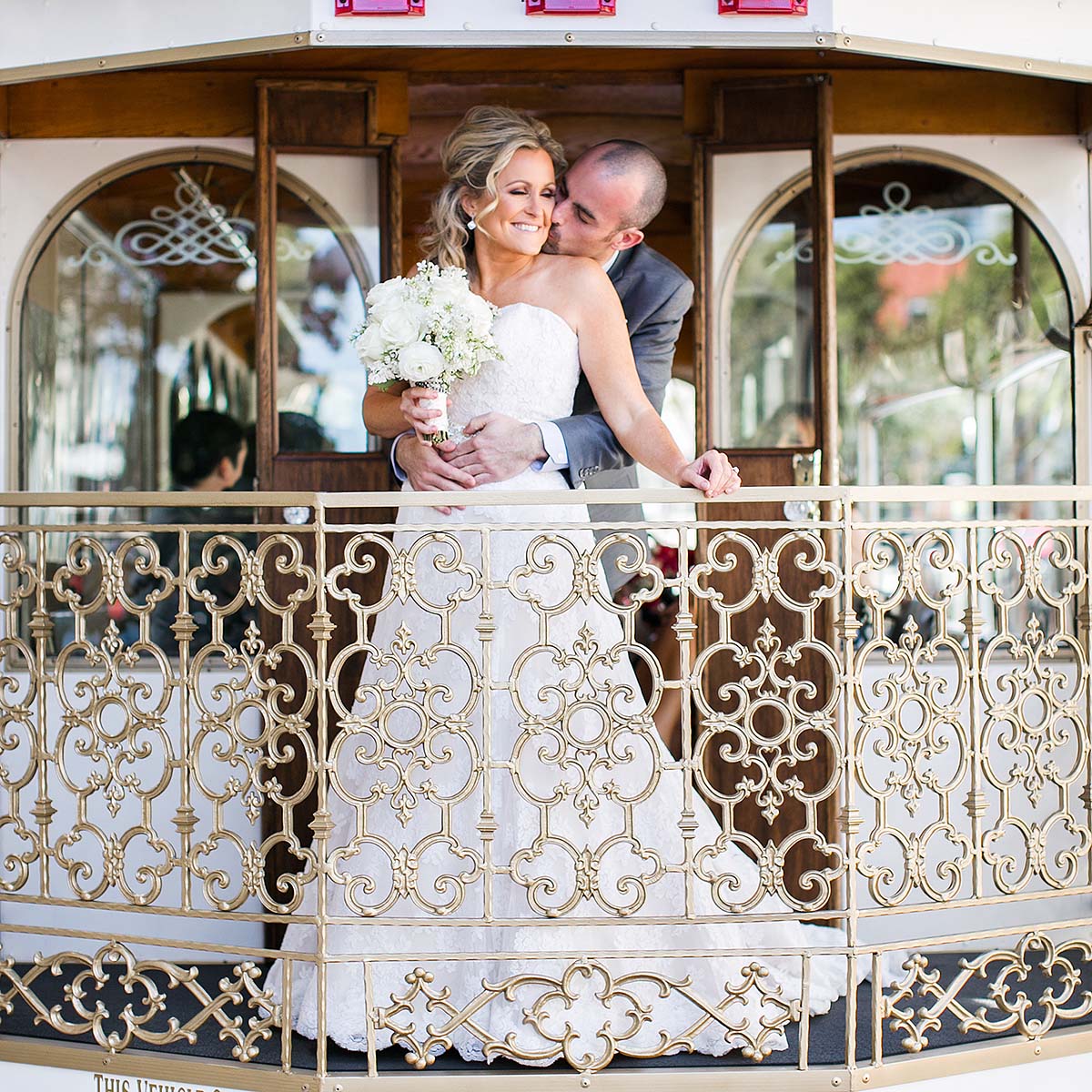 bride and groom aboard San Diego wedding trolley
