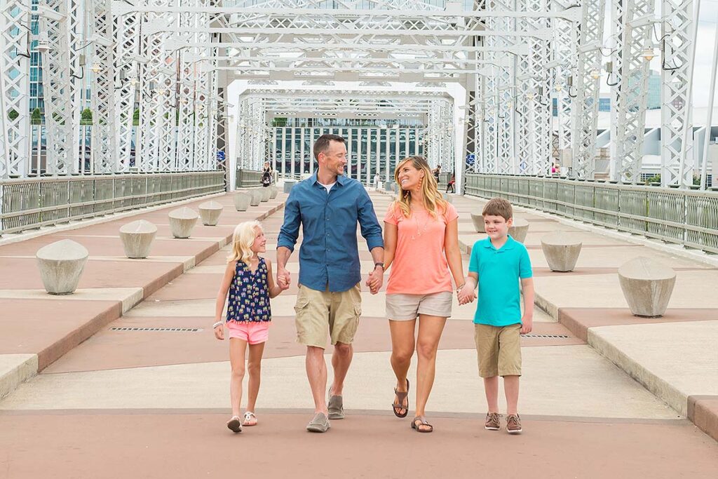 family walking on Nashville pedestrian bridge