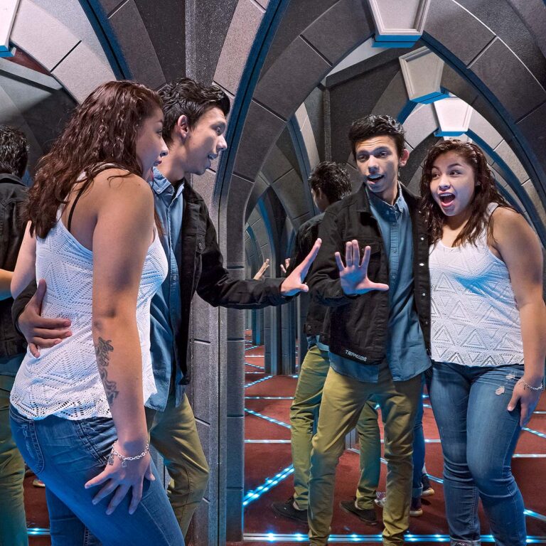 two guests inside mirror maze