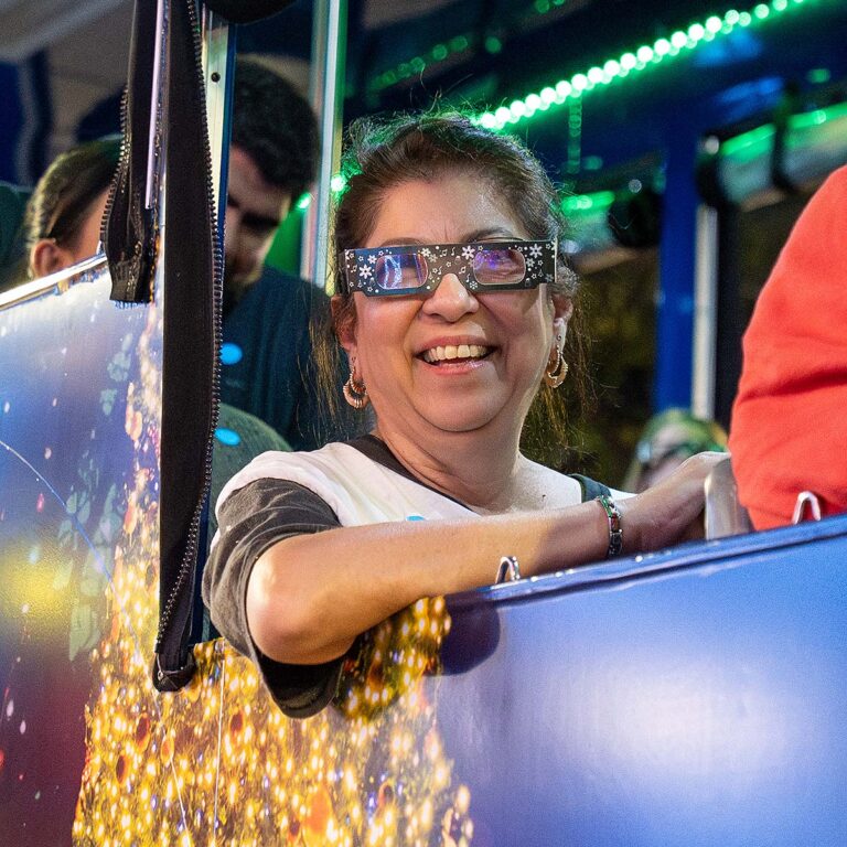 San Antonio holiday tour guest wearing holiday glasses
