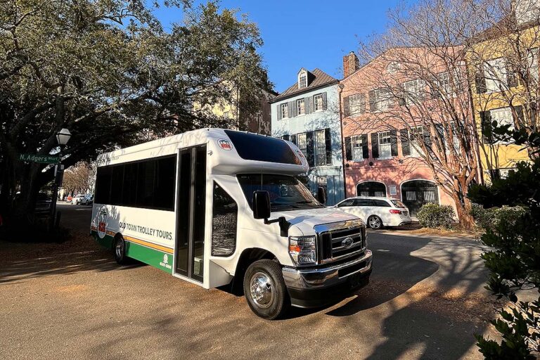 Charleston trolley driving past Rainbow Row