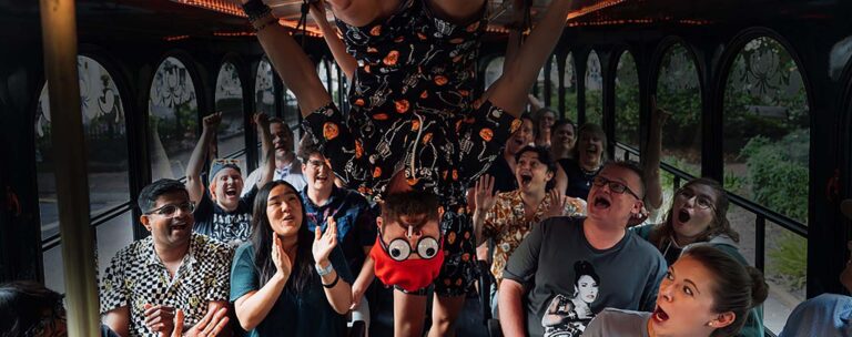 Savannah Ghost Tours for Morons host and guests inside trolley