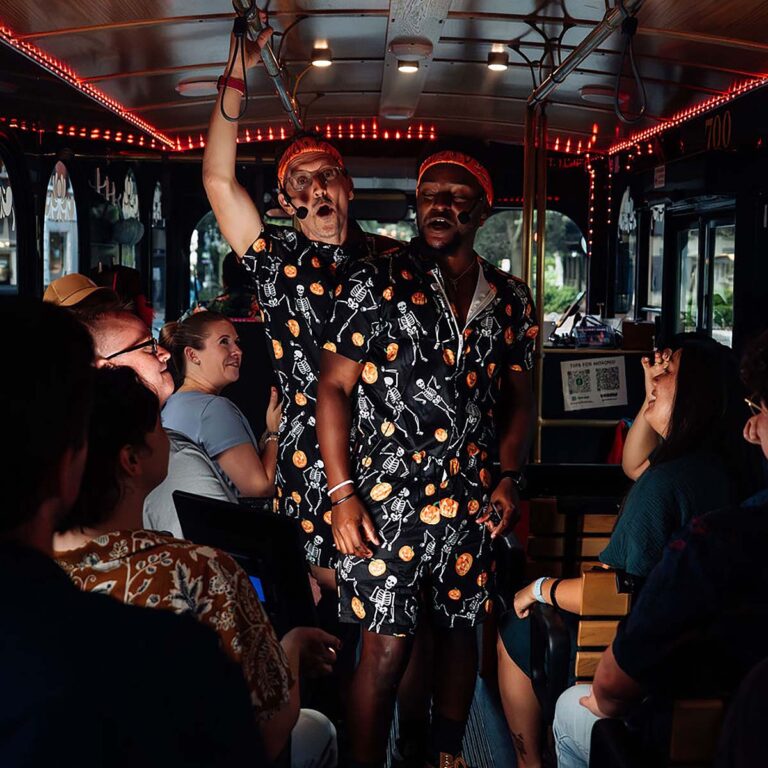 Savannah Ghost Tours for Morons host and guests inside trolley