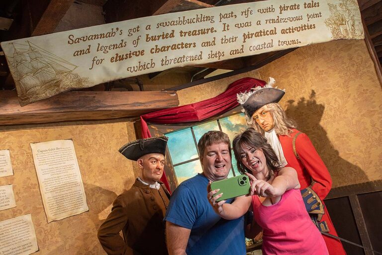 guests taking picture in front of pirate exhibit at Savannah Pirates and Treasure Museum